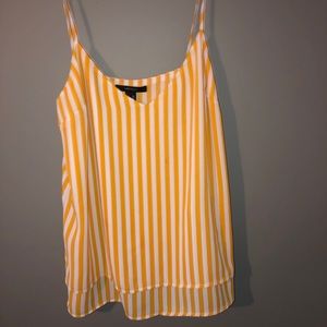 Yellow and white striped flows tanks top